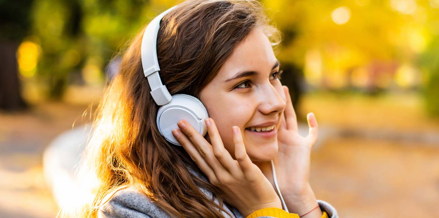 woman-listen-radio Woman listening to music that brings peace and hope